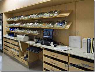 pharmacy-wall-mounted-tilt-sloped-shelving-modular-casework-millwork-shelf-medassets-premier-novation-dallas