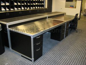 Stainless steel tables work surfaces used for storage and maintenence of sports and athletic equipment to prevent staph incestions.