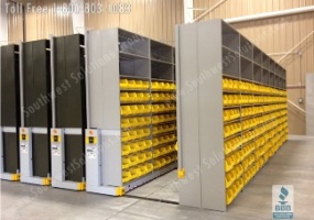 compress storage shelving bins warehouse shelves rolling on rails to compress together