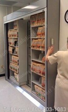 secured filing system with sliding file shelving and rolling security doors