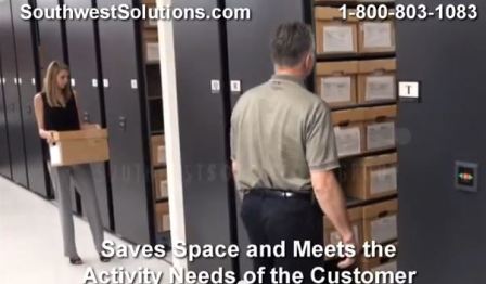 planning access aisles for two workers in rolling high capacity storage shelving saves space