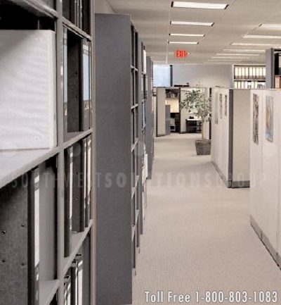 shelving ranges used as natural barriers and binder storage