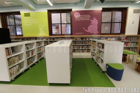 cantilever carts on wheels in a library's childrens book area