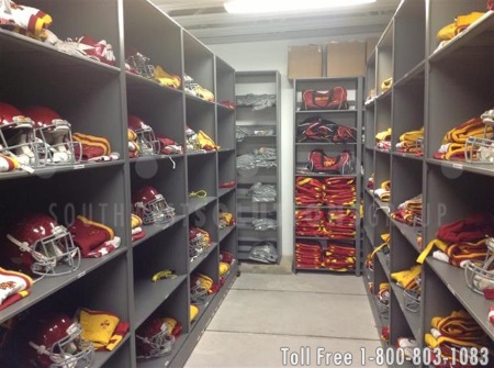 powered mobile shelving storing football helmets and jerseys