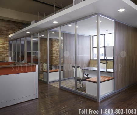 priviate offices are defined by modular walls with glass panels