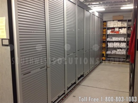 rolling security doors on mobile shelving in the football equipment room