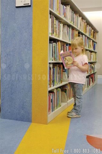 spacesaver custom end panels on cantilever shelving in the childrens section