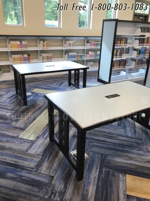 library book shelves laptop tables