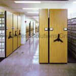 Archival compact box storage mechanical assist high density shelving
