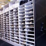 Athletic gear storage cubbies on mobile shelving