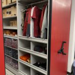 Baseball equipment room storage uniform shelving