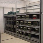 Compact mechanical assist manual mobile shelving armory storage system