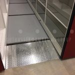 Compact shelving sliding storage system
