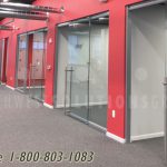 Demountable glass walls on carpet tile