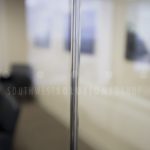 Demountable glass walls on office carpet tile