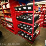 Fifo battery racks with titlted shelves