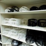 Football faceguard shelving equipment room