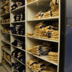 Football jersey storage shelves on mobile storage system