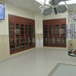 Glass door thermofoil cabinetry for surgical procedural room medical products