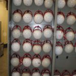 Hanging helmet uniform athletic storage equipment