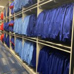 Hanging uniform storage shelving equipment room baseball