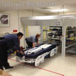 Hospital bed storage lift vertical storage biomed department