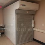 Hospital bed vertical storage lifts storing gurney stretcher