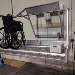 Hospital wheelchair powered storage wall lift rack system