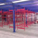 Industrial warehouse mezzanine over shelving units