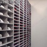 Jersey storage in cubbies on mobile shelving for university