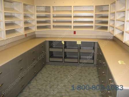 https://www.southwestsolutions.com/wp-content/uploads/2021/03/lab-tilted-upper-shelves-lower-base-cabinets-casework-drawers-trays-rolling-modular-millwork-tx-ok-ar-ks-tn.jpg