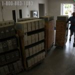 Library archives loading into high bay stacks