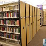 Library shelving push button mobile storage
