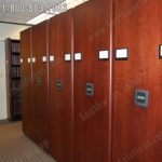 Library storage push button power shelving