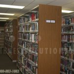 Lifting book stack loaded shelving