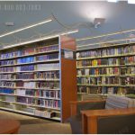 Lights on shelving stacks overhead electric with no floor coring lighting library