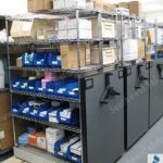 Mechanical assist high density rolling shelves bins