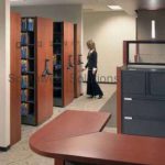 Mechanical assist high density shelving office file cabinets