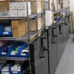 Mechanical assist high density storage wire racks