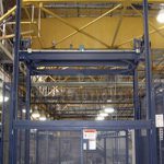 Mechanical lift mezzanine freestanding