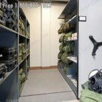 Military gas mask storage high density hand crank shelving