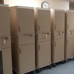 Mobile patient supply stations pass thru cabinets
