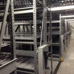 Mobile shelving storage system in refrigerated storage cooler