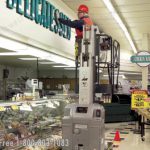 Mobile stock picker grocery store work man lift