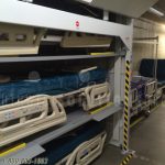 Motorized bedlifts gurneys stretchers vertical storage