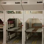Motorized vertical bedlift gurney stretcher storage