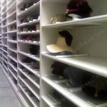 Museum cabinet collection hats wigs storage archives rare moving rack
