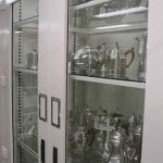 Museum cabinet silver storage glass doors sealed view archives antique artifact shelf