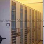 Museum mechanical assist high density shelving cabinets compact storage
