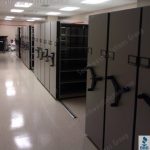 Operating room storage shelving wheelhouse mechanical assist